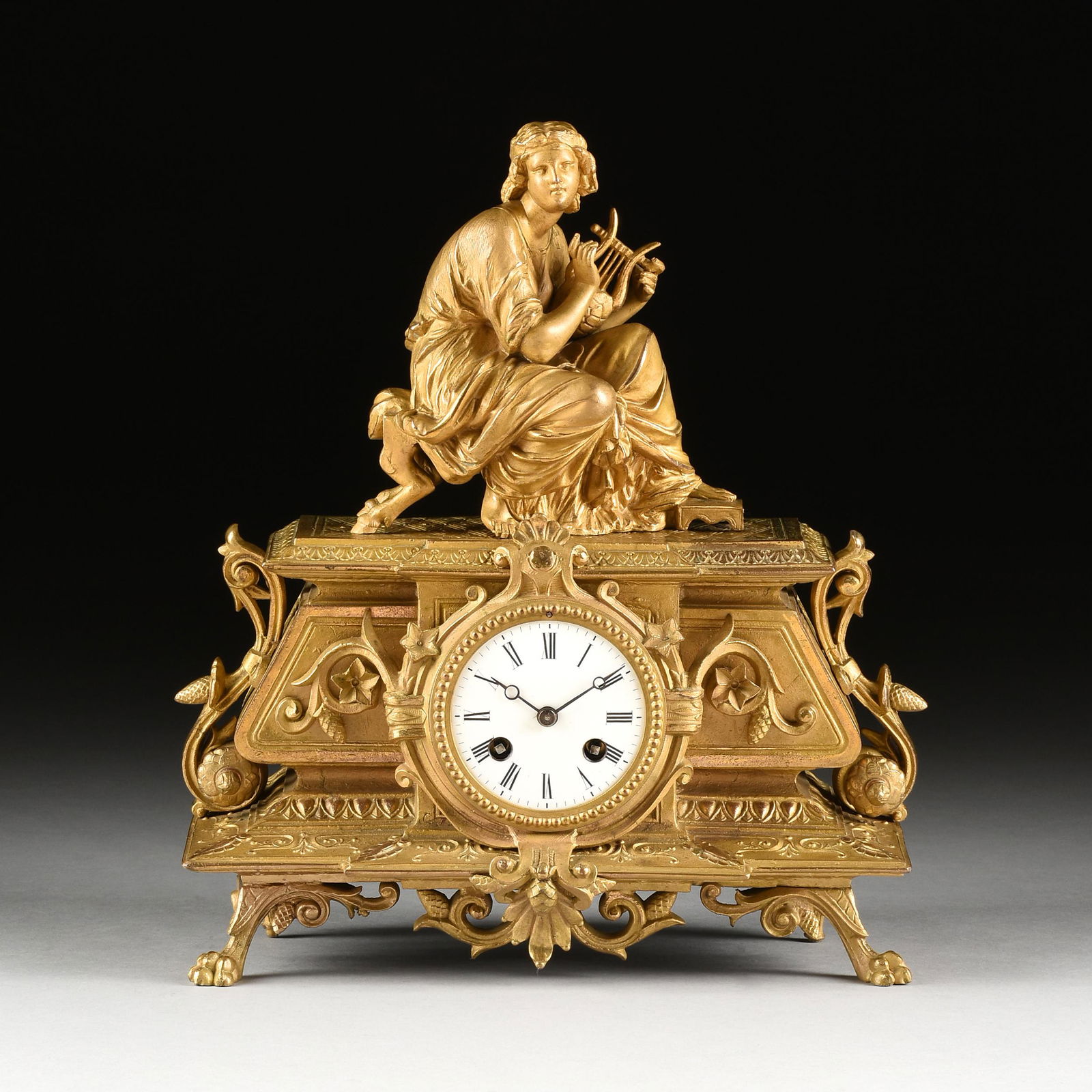 A NAPOLEON III NEO-GREC GILT METAL CLOCK, "Allegory of (1 of 11)