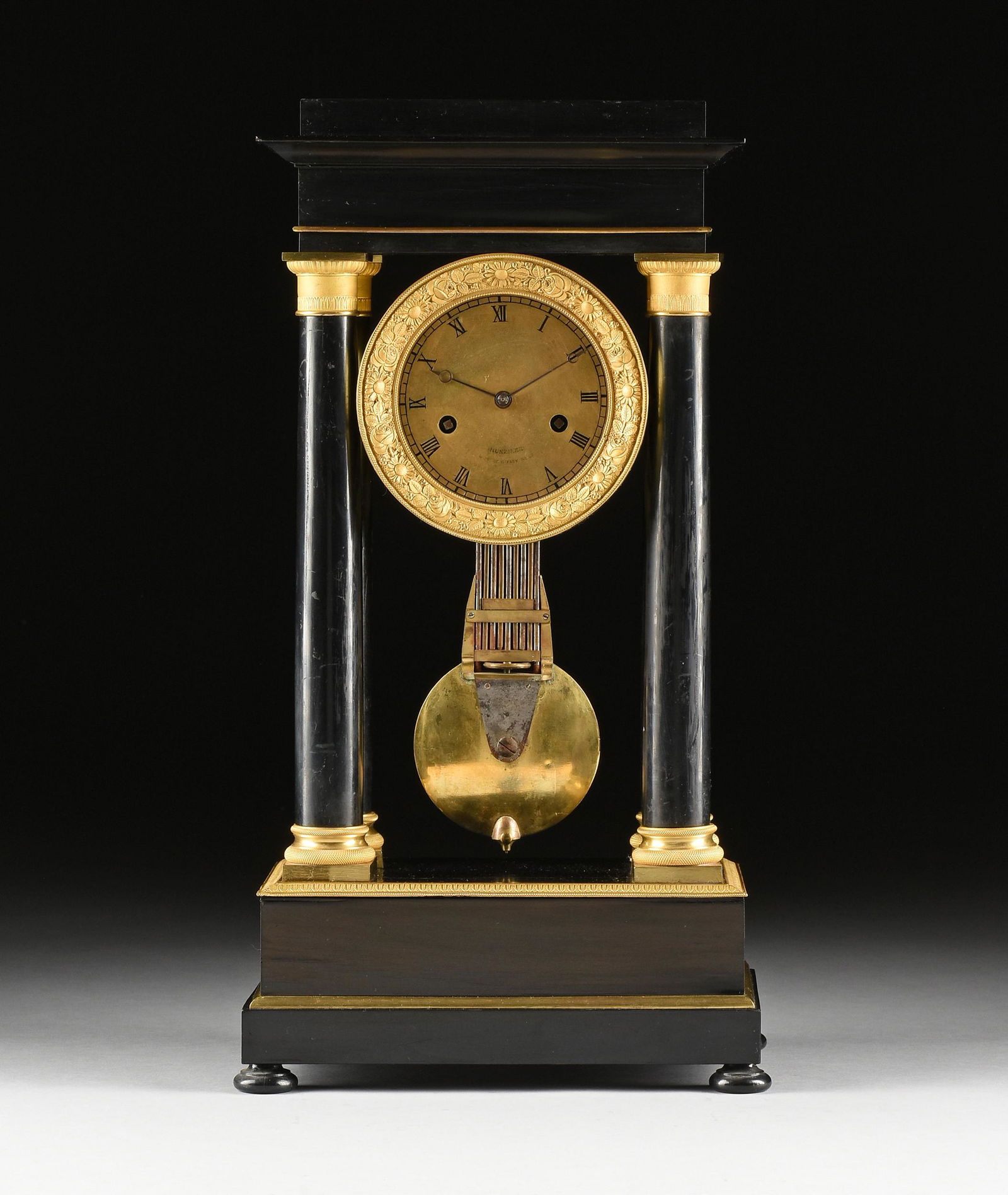 A CHARLES X ORMOLU MOUNTED EBONIZED WOOD PORTICO CLOCK, (1 of 6)