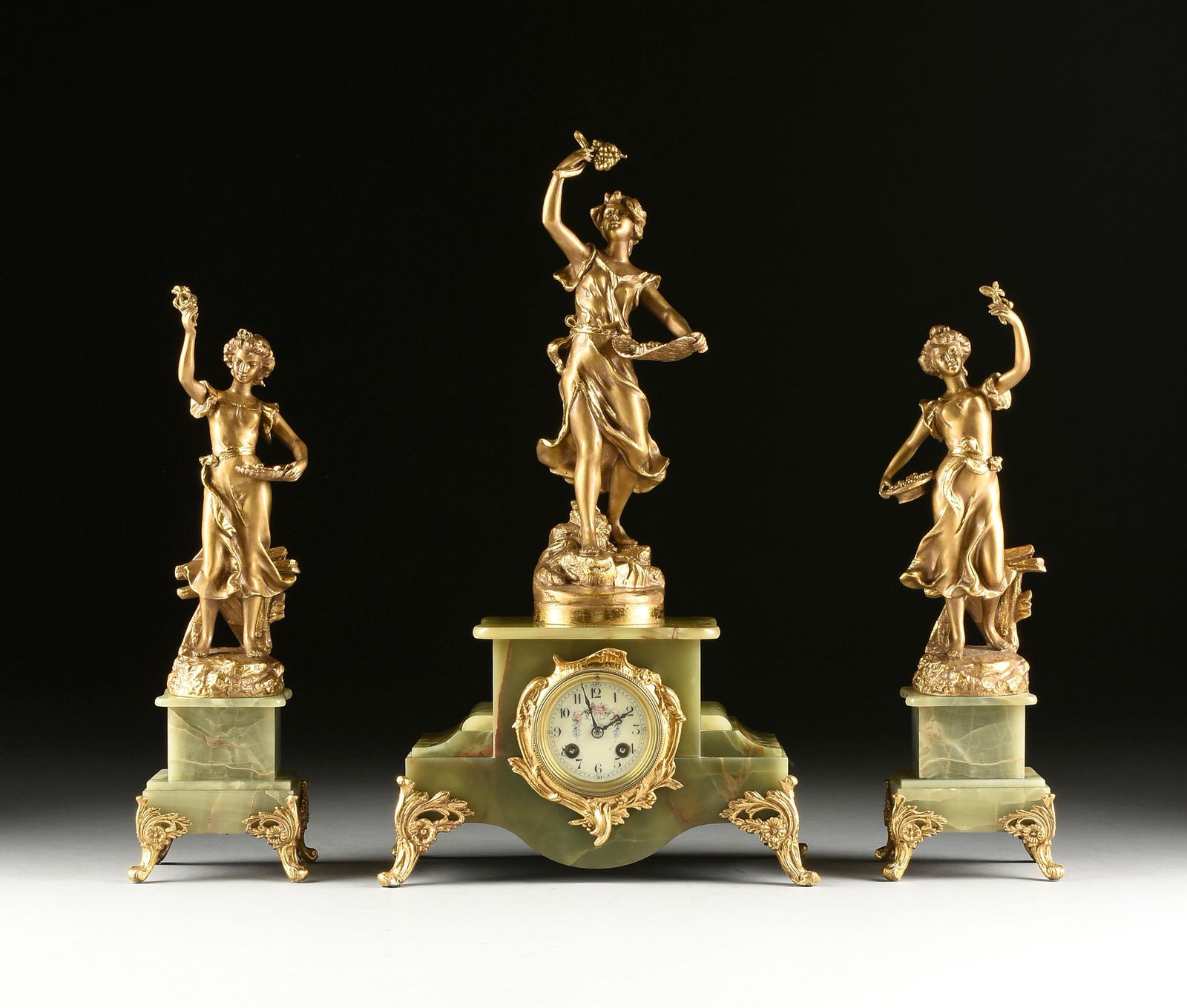AN ART NOUVEAU GILT METAL AND ONYX THREE PIECE CLOCK (1 of 13)