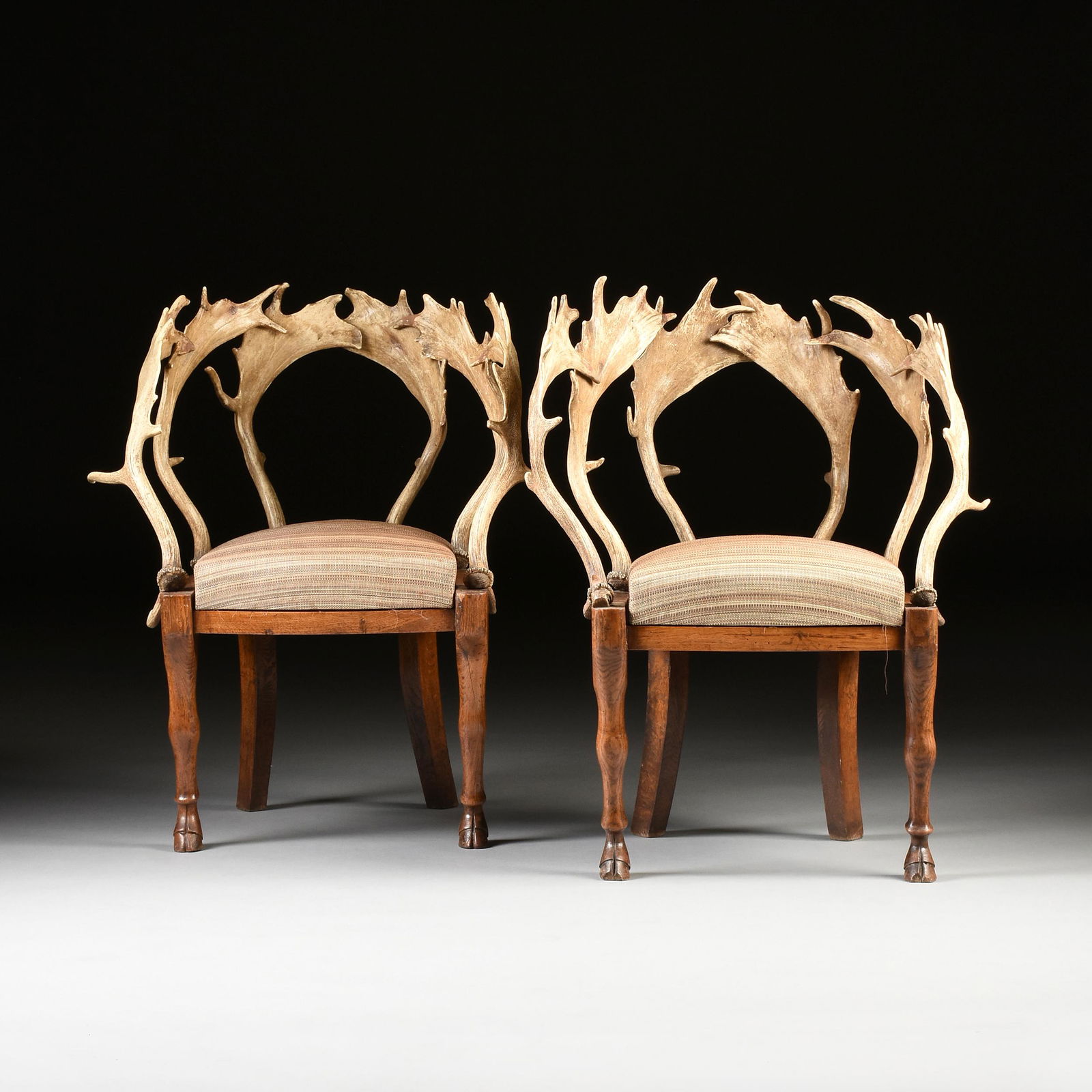 A PAIR OF BIEDERMEIER ANTLER AND CARVED ELM CHAIRS, (1 of 8)