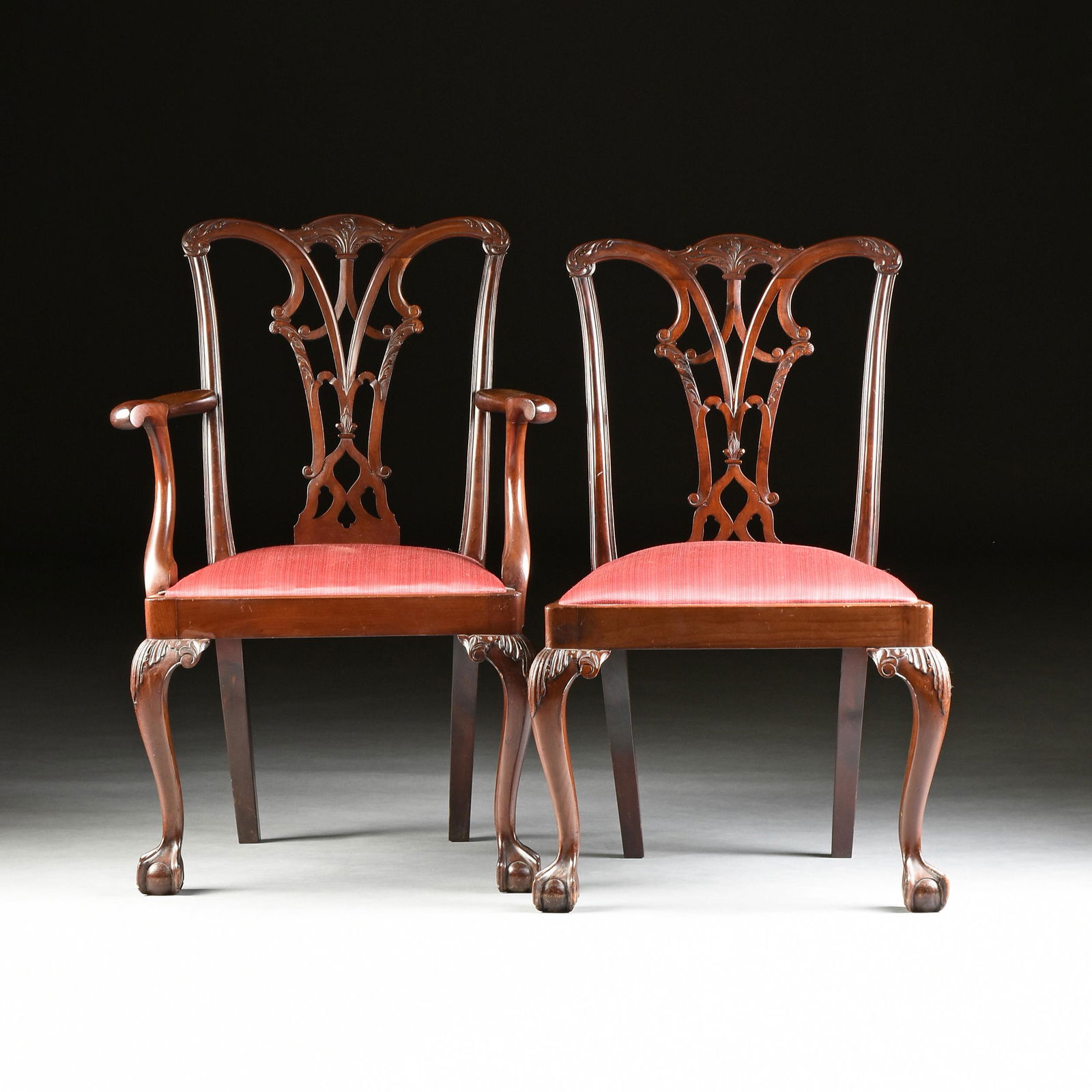 A SET OF EIGHT GEORGE III (1760-1811) STYLE MAHOGANY: A SET OF EIGHT GEORGE III (1760-1811) STYLE MAHOGANY DINING CHAIRS, AFTER THOMAS CHIPPENDALE (1718-1779), LATE 19TH/EARLY 20TH CENTURY, in the Gothic Revival taste, comprising six side chairs and two