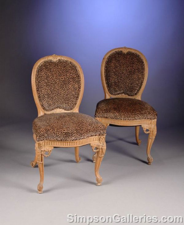 A SET OF FOUR LOUIS XV STYLE CARVED BEECHWOOD CHA: A SET OF FOUR LOUIS XV STYLE CARVED BEECHWOOD CHAISES, the shaped oval padded backrest with a scrolling acanthus pendant and guilloche carved frame on a serpentine trapizoidal seat on a fluted seat ra