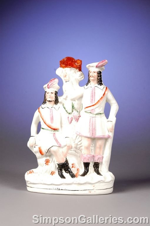 AN ANTIQUE ENGLISH STAFFORDSHIRE FIGURAL SPILL VA
