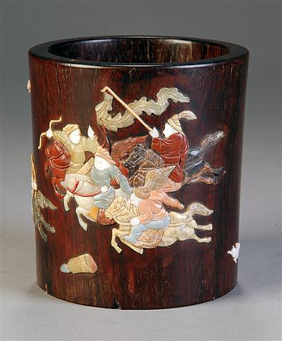 AN ANTIQUE CHINESE MOTHER-OF-PEARL AND SOAPSTONE MO: AN ANTIQUE CHINESE MOTHER-OF-PEARL AND SOAPSTONE MOUNTED HUANGHUALI BRUSH POT, early 20th century, of crylindrical form mounted with archery huntsmen on horseback in pursuit of prey, with billowing cl