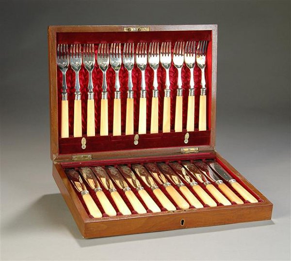 A VICTORIAN SILVER PLATED AND IVORY MOUNTED FISH S: A VICTORIAN SILVER PLATED AND IVORY MOUNTED FISH SERVICE, stamped W & HS, each piece engraved with a scrolling acanthus leaf above an ivory handle. In original red silk lined presentation box.