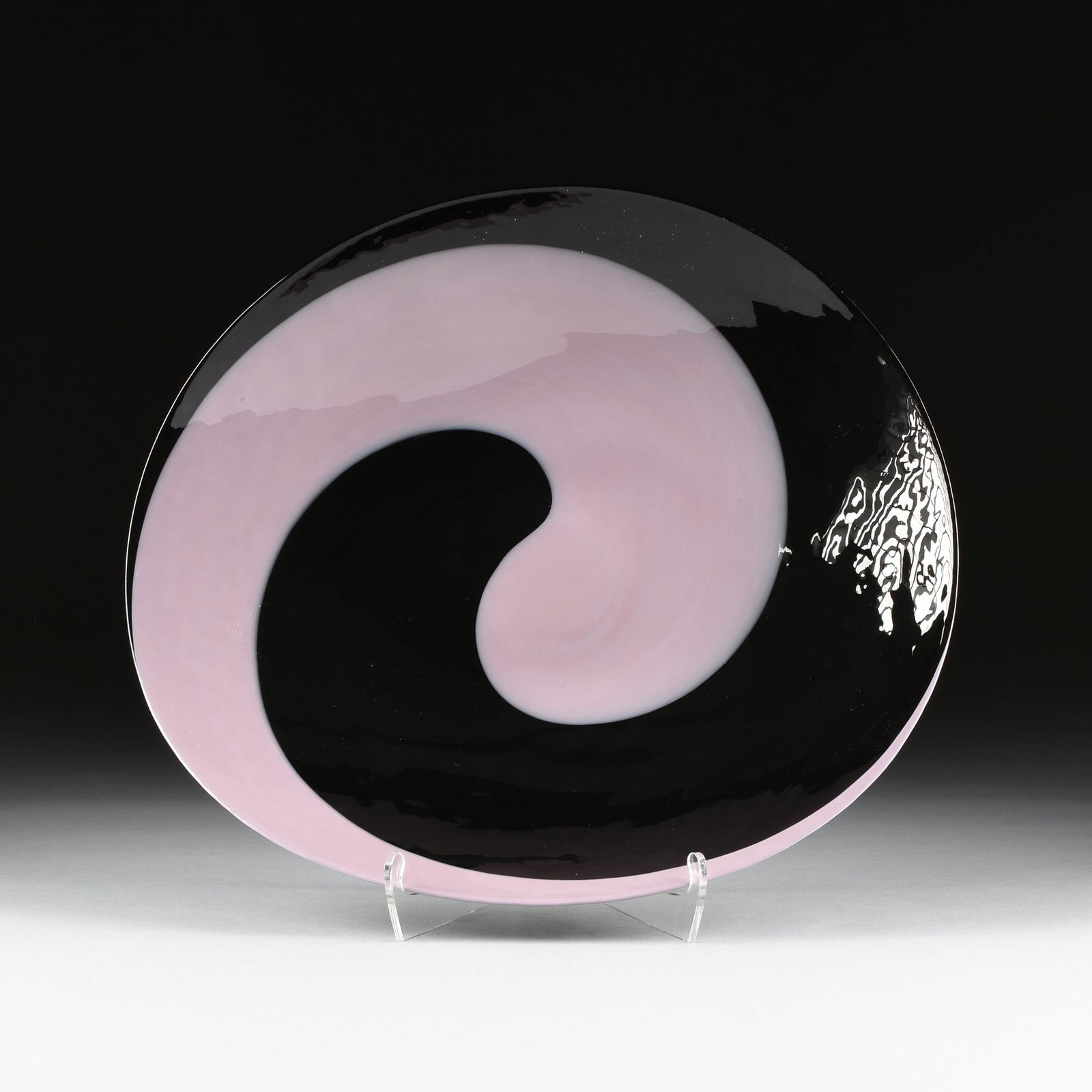 A MURANO SWIRLED PURPLE AND BLACK ART GLASS GLASS: A MURANO SWIRLED PURPLE AND BLACK ART GLASS GLASS CENTER BOWL, GUIDO FERRO, ITALIAN, CIRCA 1980, the shaped large oval bowl of swirled black and purple Alexandrite glass with anchor "Ferro Murano" mar