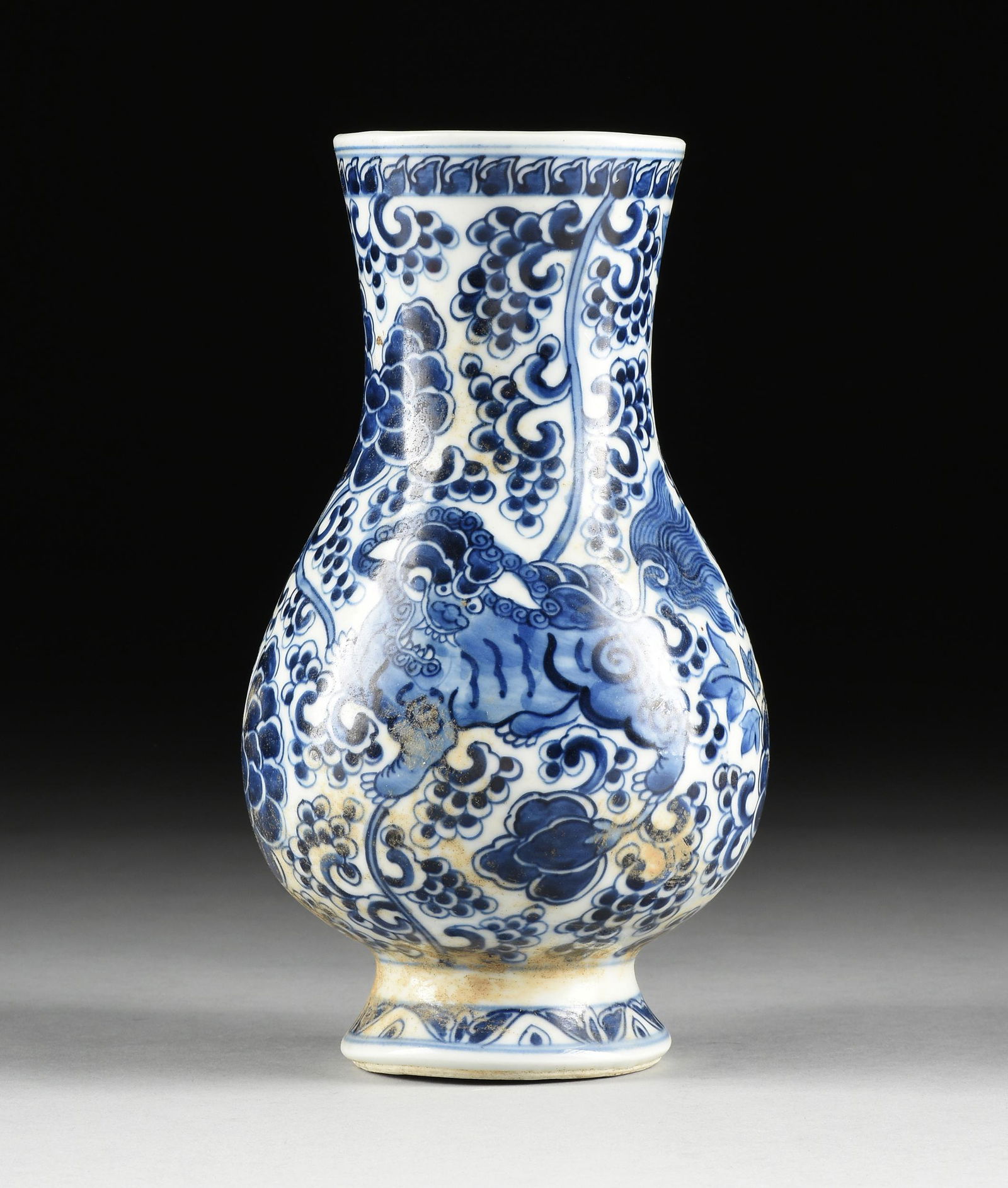 A CHINESE BLUE AND WHITE BUDDHISTIC LION PAINTED VASE, (1 of 10)