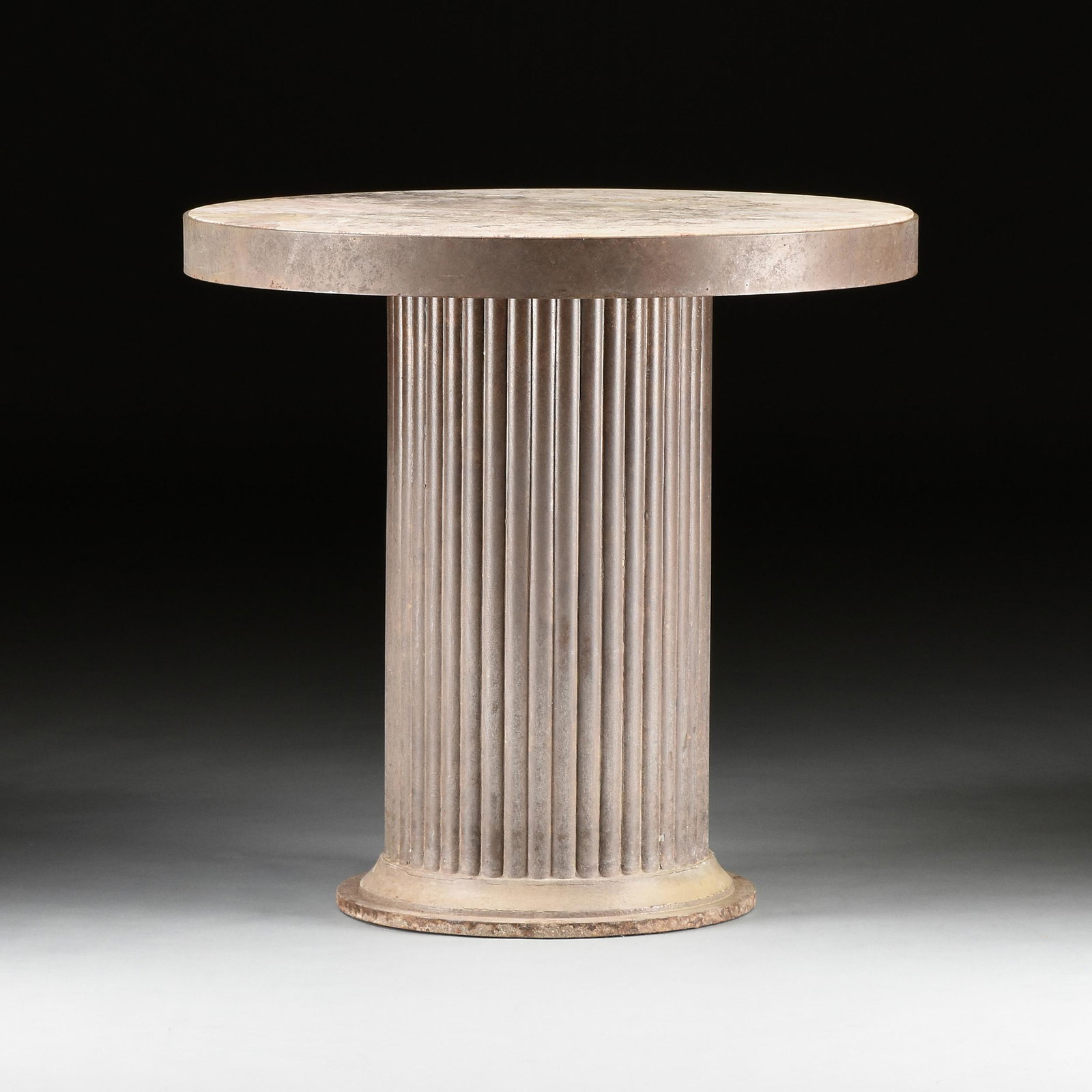 A MODERNIST MARBLE AND IRON GARDEN TERRACE TABLE, LATE: A MODERNIST MARBLE AND IRON GARDEN TERRACE TABLE, LATE 20TH CENTURY, an inset fleur de pêche style variegated pale pink and grey marble within a wideband edge, raised on a lobed column ending on in
