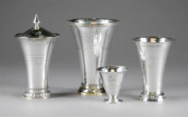 A GROUP OF FOUR SWEDISH STERLING SILVER BEAKERS, s: A GROUP OF FOUR SWEDISH STERLING SILVER BEAKERS, second quarter 20th century, comprising a flared conical form beaker with silver gilt molded rim above a broad border of bright cut scattered floral sp