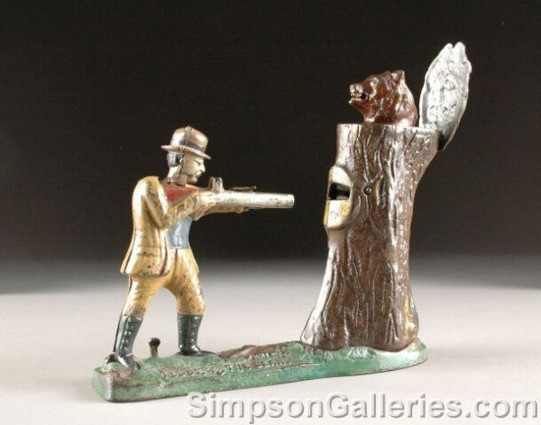 A RARE J & E STEVENS "TEDDY ROOSEVELT AND THE BEAR": A RARE J & E STEVENS "TEDDY ROOSEVELT AND THE BEAR" CAST-IRON MECHANICAL BANK, circa 1907, designed by Charles Bailey. Stamped "pat applied for". Height: 9 1/2", width 21 1/2", length: 10 1/8". From t