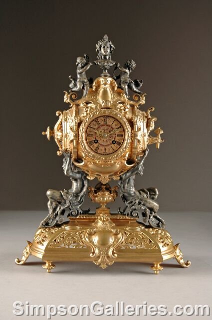 A RENAISSANCE REVIVAL GILT AND SILVERED BRONZE MAN: A RENAISSANCE REVIVAL GILT AND SILVERED BRONZE MANTLE CLOCK, Lenzkirch Movement, circa 1880, for the German market, the circular dial with black enamel Roman chapters and reticulated hands above twin 