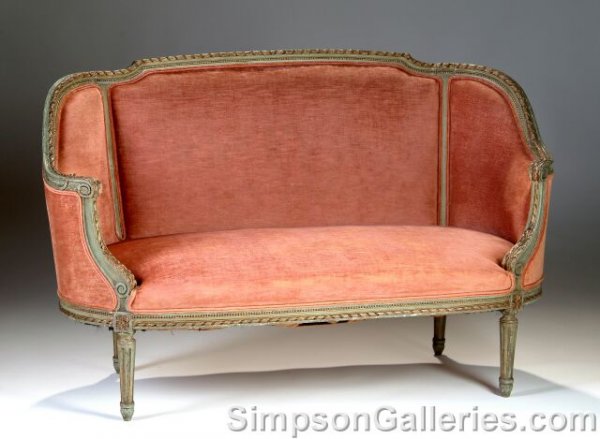 A LOUIS XVI STYLE PARCEL GILT AND GREEN PAINTED CA: A LOUIS XVI STYLE PARCEL GILT AND GREEN PAINTED CANAPÉ EN CORIBEILLE, late 19th century, the ribbon and rod carved frame with beaded trim enclosed by conforming padded back and downswept sides ending