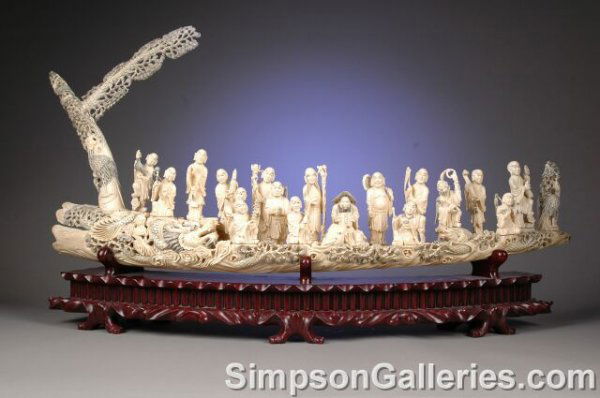 A CHINESE CARVED IVORY FIGURAL GROUP OF EIGHTEEN I: A CHINESE CARVED IVORY FIGURAL GROUP OF EIGHTEEN IMMORTALS, second half 20th century, the intricately sculpted figures having individual expressive faces and long draping robes while holding their var