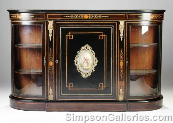 A VICTORIAN GILT BRONZE MOUNTED EBONIZED WOOD AND : A VICTORIAN GILT BRONZE MOUNTED EBONIZED WOOD AND MARQUETRY INLAID SIDEBOARD CABINET, late 19th century, the beaded bow-front demilune top above a frieze centering inlaid scrolling foliage above a cen