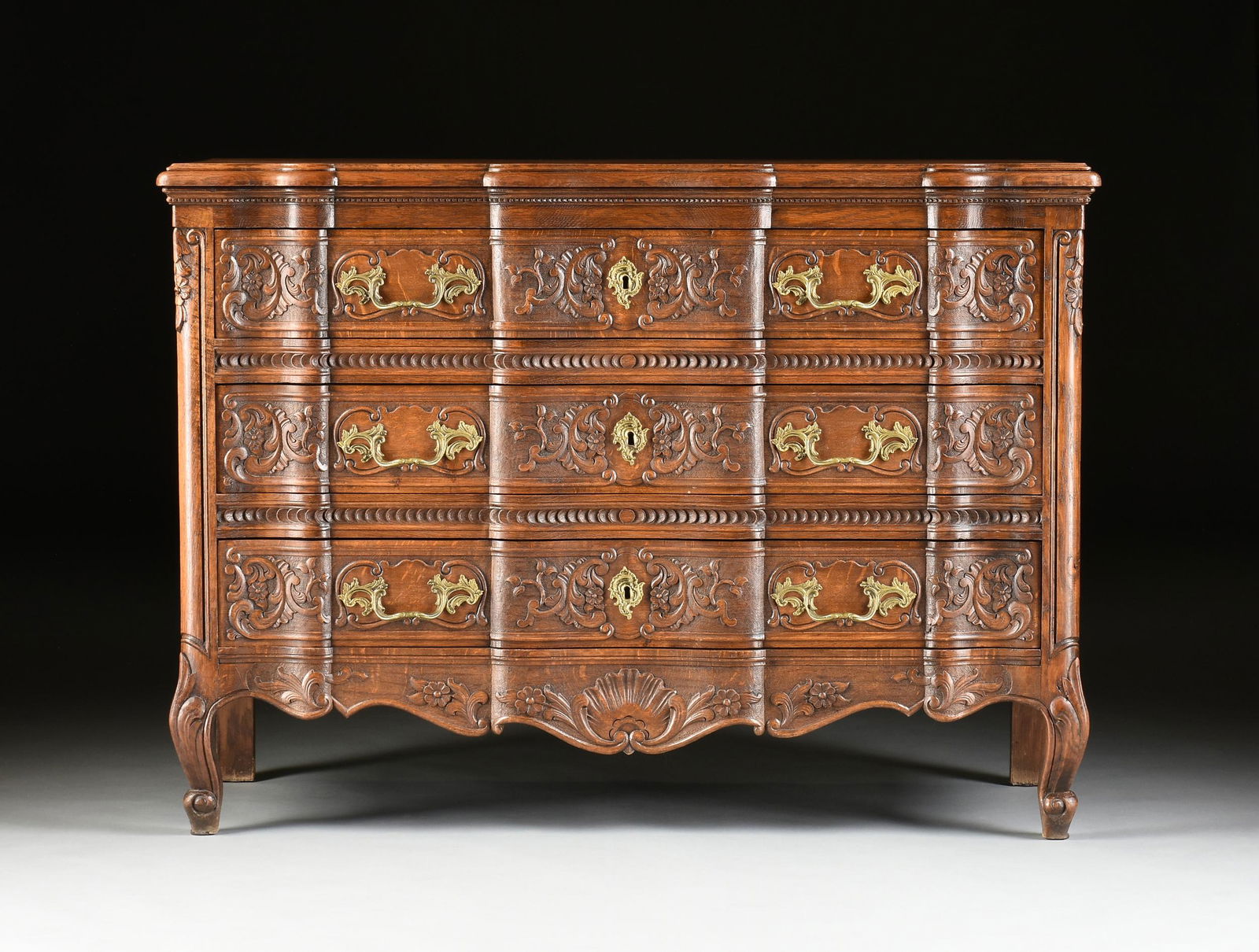 A FRENCH PROVINCIAL STYLE BRONZE MOUNTED OAK COMMODE, (1 of 12)