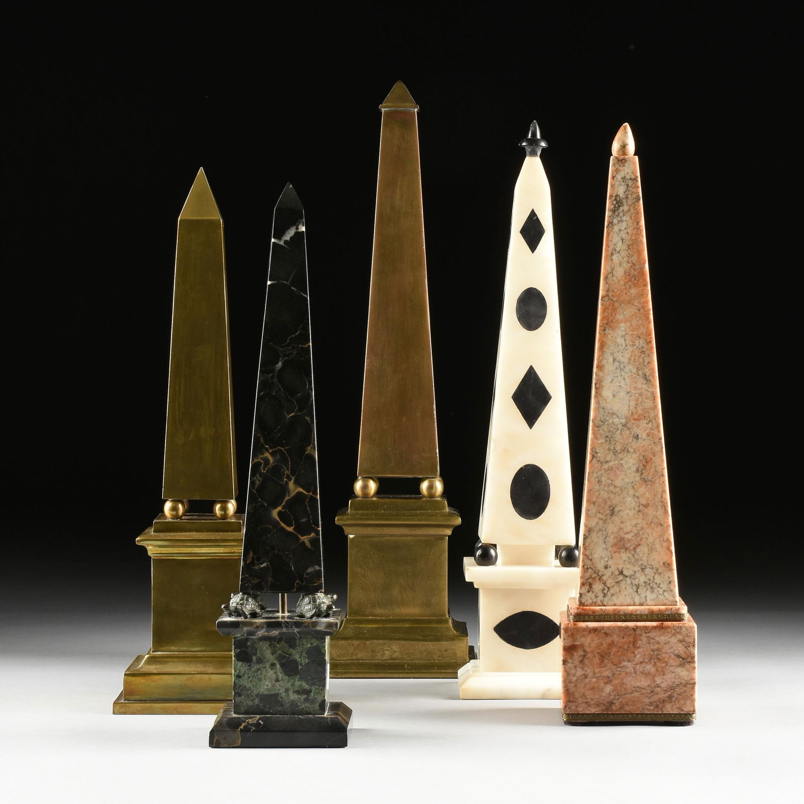 A GROUP OF FIVE GRAND TOUR STYLE MARBLE AND BRASS: A GROUP OF FIVE GRAND TOUR STYLE MARBLE AND BRASS OBELISKS, ITALIAN, 19TH/20TH CENTURY, each of traditional form and comprising one modeled after the Boboli obelisk in Florence and of Portoro Macchia