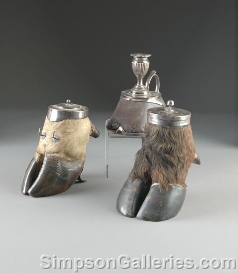 AN ANTIQUE SILVER PLATED MOUNTED HORSE HOOF CANDLES: AN ANTIQUE SILVER PLATED MOUNTED HORSE HOOF CANDLESTICK, together with a silverplated mounted oxen hoof box, and a sterling silver mounted oxen hoof inkwell. Height: 7", 8", 6 1/2". (3 LOT)