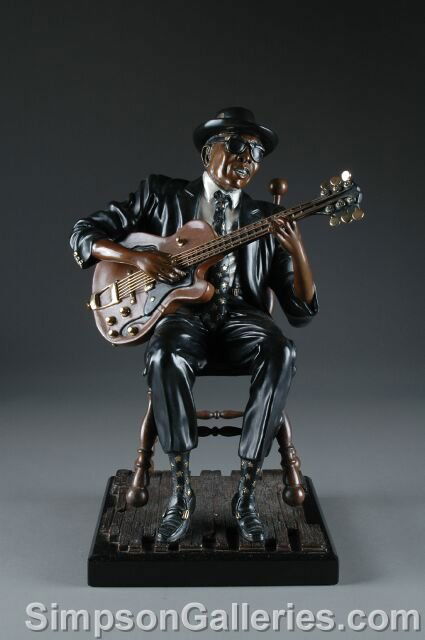 P. WEGNER (American Contemporary) A BRONZE SCULPT: P. WEGNER (American Contemporary) A BRONZE SCULPTURE, "Jazz Guitarist," numbered 14/175. On granite plinth. Height: 20", width: 13"