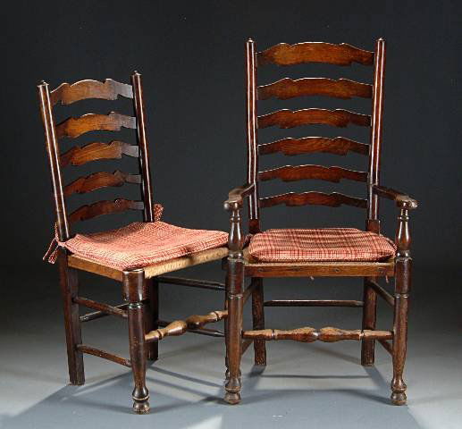 A SET OF ENGLISH ELM LADDERBACK DINING CHAIRS, 19t: A SET OF ENGLISH ELM LADDERBACK DINING CHAIRS, 19th century, comprising two armchairs, and five side chairs, each with graduated shaped back splats, flanked by columnar stiles, on trapezoidal rush wov