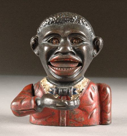 AN AMERICAN CAST-IRON "LITTLE JOE" MECHANICAL BANK: AN AMERICAN CAST-IRON "LITTLE JOE" MECHANICAL BANK attributed to John Harper & Co., circa 1910. With original paint, some paint loss. Height: 5 1/2".
