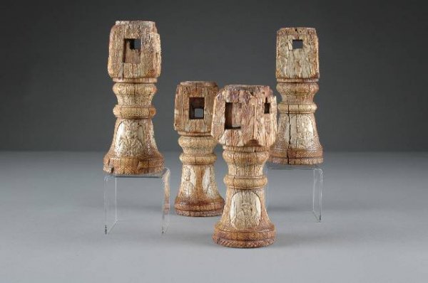 A RARE SET OF FOUR MUGHAL CARVED IVORY PALANQUIN S: A RARE SET OF FOUR MUGHAL CARVED IVORY PALANQUIN SUPPORTS, 18th century, each of baluster form and carved in relief with oval vignettes of Mughal warriors. Circa 1750. Height: 7 3/4". (4)