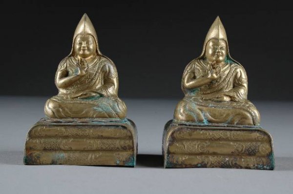 A PAIR OF CHINESE QING GILT BRONZE FIGURES OF MAST: A PAIR OF CHINESE QING GILT BRONZE FIGURES OF MASTER ZONG KA BA, 19th century, hands held in Buddhist Mudra. Height: 4", width: 2 3/4", depth: 2 1/4".