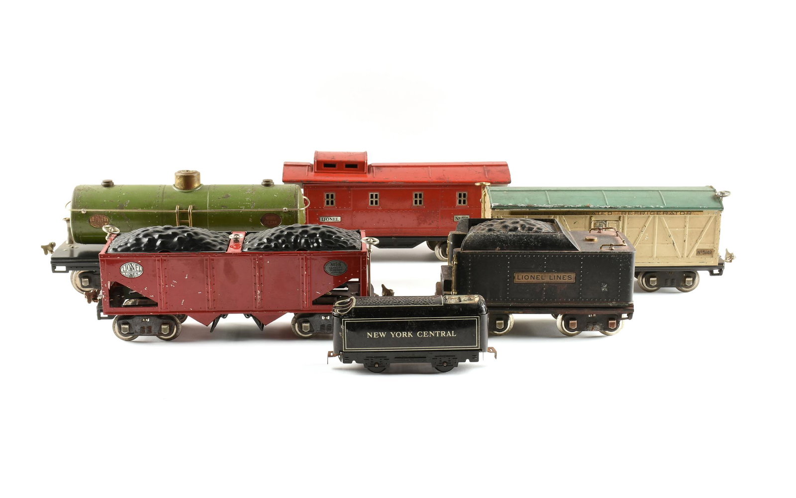 A GROUP OF SIX LIONEL PASSENGER, COAL, OIL, AND: A GROUP OF SIX LIONEL PASSENGER, COAL, OIL, AND REFRIGERATOR CARS, PRE AND POST WAR, comprising #215, old production green/black Oil Car; #384T, a pre-war black Coal Tender Car; #514R, green and tan V