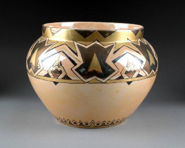 AN ART DECO LUSTER WARE PORCELAIN JARDINIÈRE by Be: AN ART DECO LUSTER WARE PORCELAIN JARDINIÈRE by Bernardaud & Company, Limoges, France, the tapered bulbous sides surmounted by a short neck decorated with a broad band of geometric panels alternating
