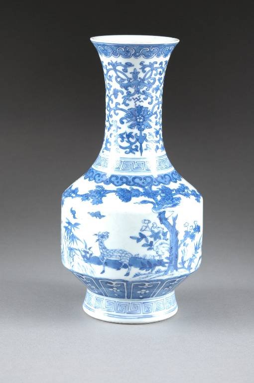 AN ANTIQUE CHINESE BLUE AND WHITE PORCELAIN VASE, : AN ANTIQUE CHINESE BLUE AND WHITE PORCELAIN VASE, 19TH CENTURY, enameled with a deer set amidst a landscape of pines, blossoming prunus, and bamboo beneath flying bats and a shoulder of continuous ruy