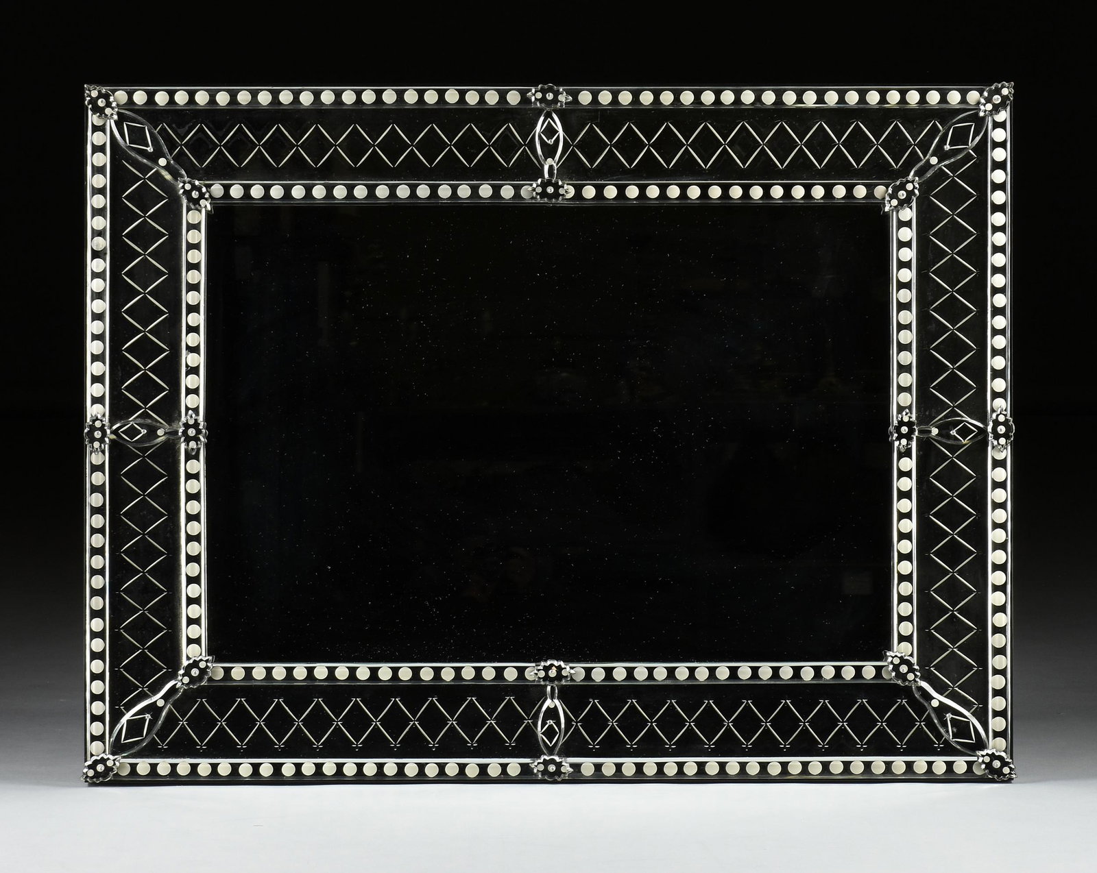 A VENETIAN STYLE ETCHED AND ENGRAVED GLASS MIRROR, (1 of 3)