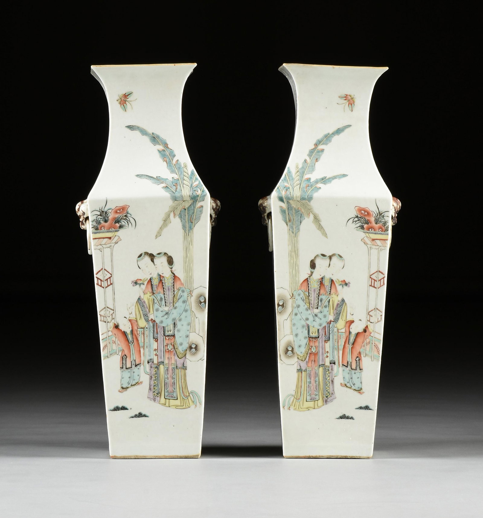 A PAIR OF CHINESE REPUBLIC PERIOD "NOBLE MOTHER AND: A PAIR OF CHINESE REPUBLIC PERIOD "NOBLE MOTHER AND ATTENDANT WITH BOY" PORCELAIN VASES, 1912-1949, each of tall square form and a flared rim above a waisted neck flaring to conforming tapered sides, 