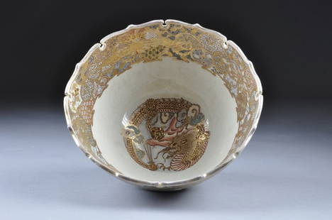 A FINE SATSUMA BOWL with scalloped rim, the exterio: A FINE SATSUMA BOWL with scalloped rim, the exterior enameled with maidens and dignitaries in a mountainous landscape. On carved hardwood stand. Height: 7" Diameter: 13"