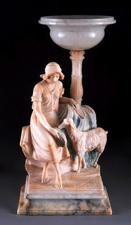AN ITALIAN CARVED ALABASTER FIGURAL LAMP, SIGNED R: AN ITALIAN CARVED ALABASTER FIGURAL LAMP, SIGNED R. CACIVICCHI, LATE 19TH/EARLY 20TH CENTURY, sculpted as a young maiden with her goat guarding the dog's wheat harvest on a rectangular molded plinth b