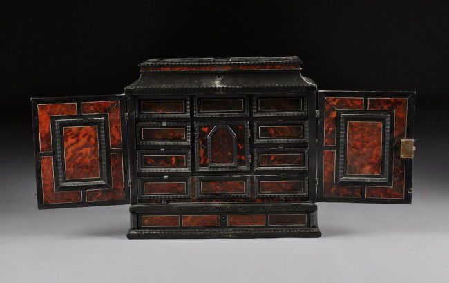 A CONTINENTAL BAROQUE IVORY, EBONY AND TORTOISESHE: A CONTINENTAL BAROQUE IVORY, EBONY AND TORTOISESHELL COLLECTOR'S CABINET, POSSIBLY ANGLO-DUTCH, 18TH CENTURY, the hinged rectangular lid opening to paired paneled interior centering a mirror plate abo