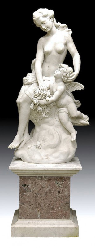 A FRENCH CARVED WHITE MARBLE SCULPTURE OF VENUS AN: A FRENCH CARVED WHITE MARBLE SCULPTURE OF VENUS AND CUPID, SIGNED FORNEAUX, PARIS, 1842, the scantily clad goddess amidst billowing clouds caressing Cupid while admiring his floral bouquet tribute whi