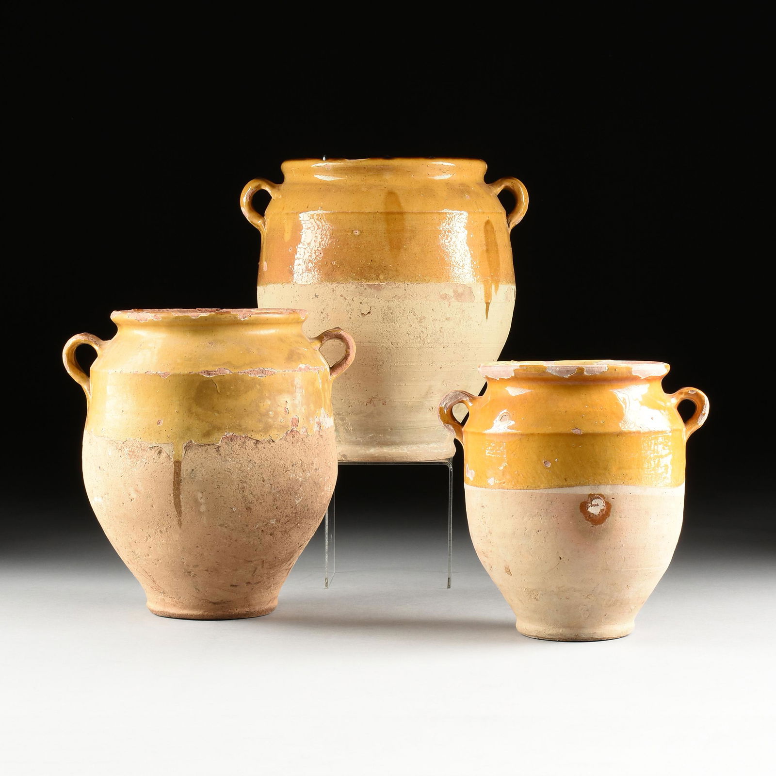 THREE FRENCH PROVINCIAL STYLE YELLOW GLAZED TERRACOTTA CONFIT JARS, 20TH CENTURY, (1 of 10)