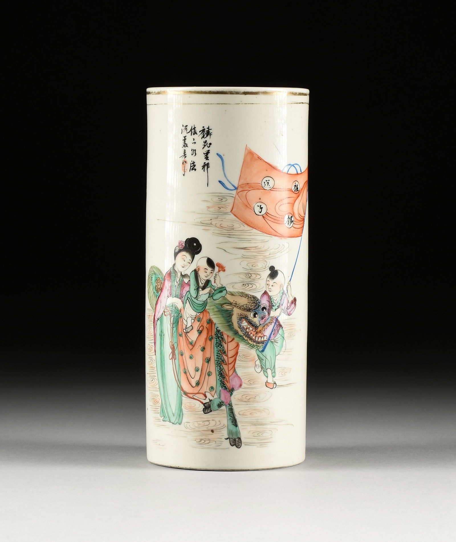 A CHINESE FAMILLE ROSE ENAMELED PORCELAIN BITONG BRUSH WASHER, BOY ON QILIN PROCESSION, LATE 20TH: A CHINESE FAMILLE ROSE ENAMELED PORCELAIN BITONG BRUSH WASHER, BOY ON QILIN PROCESSION, LATE 20TH CENTURY, of cylindrical form, a lady in long robes and chignon hairstyle walks alongside, supporting a