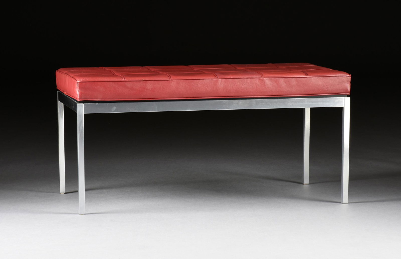 FLORENCE KNOLL (American 1917-2019) A BUTTON TUFTED LEATHER AND STAINLESS STEEL BENCH, FOR KNOLL (1 of 4)