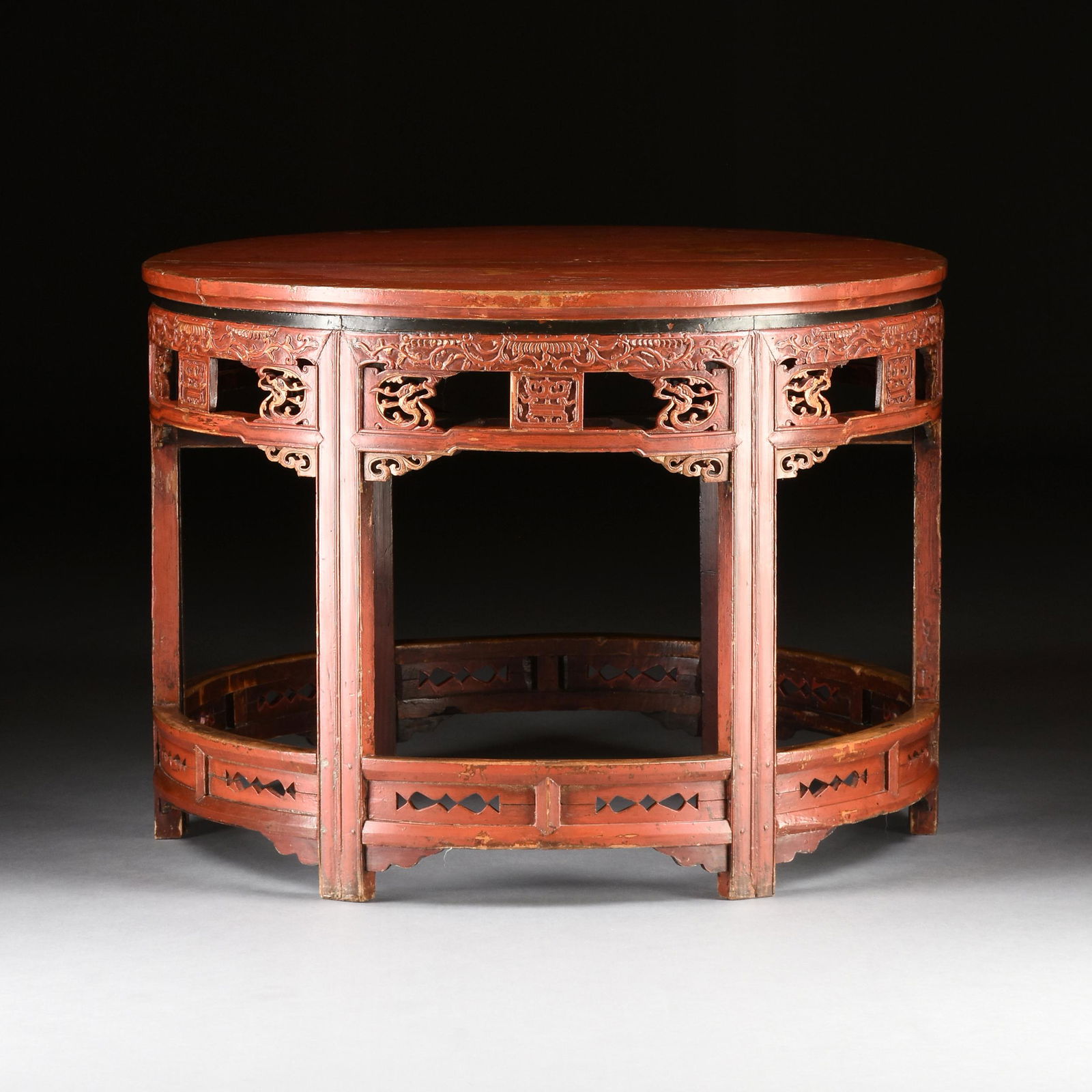 A CHINESE RED LACQUERED WOOD CIRCULAR DINING TABLE, LATE QING DYNASTY/ EARLY REPUBLIC PERIOD, (1 of 10)