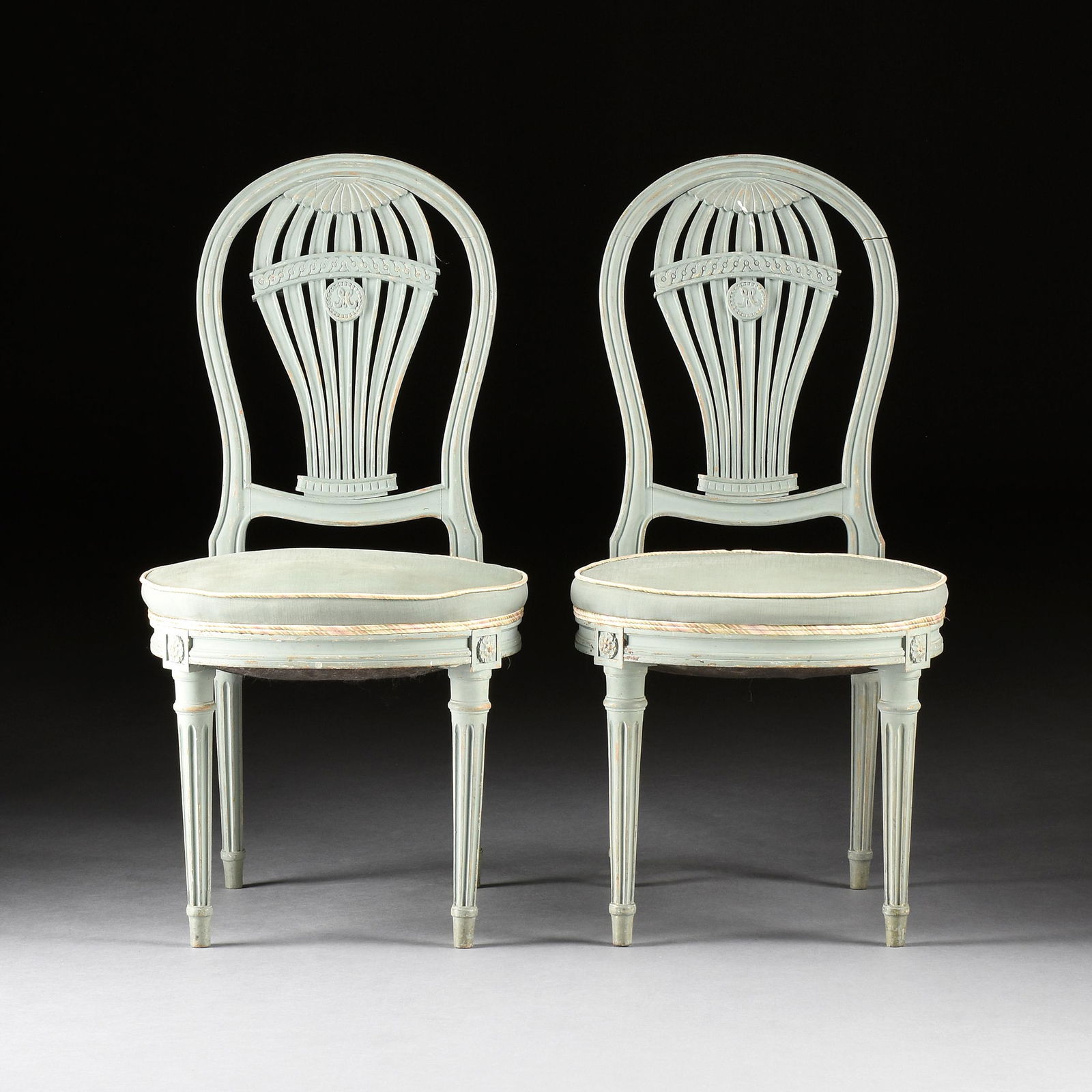 EIGHT LOUIS XVI STYLE PAINTED WOOD BALLOON BACK CHAISES À LA MONTGOLFIÈRE, POSSIBLY MAISON: EIGHT LOUIS XVI STYLE PAINTED WOOD BALLOON BACK CHAISES À LA MONTGOLFIÈRE, POSSIBLY MAISON JANSEN, EARLY 20TH CENTURY, each with a carved molding balloon form back frame enclosing a pierced