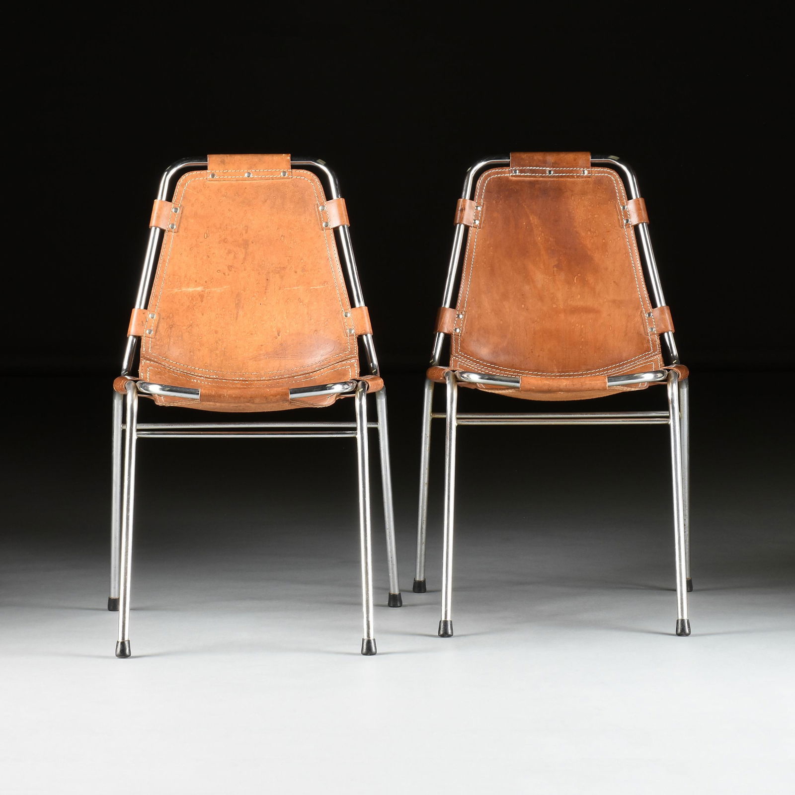 CHARLOTTE PERRIAND (French 1903-1999) FOUR LEATHER AND CHROME SIDE CHAIRS, "Les Arcs," CIRCA 1970s, (1 of 8)