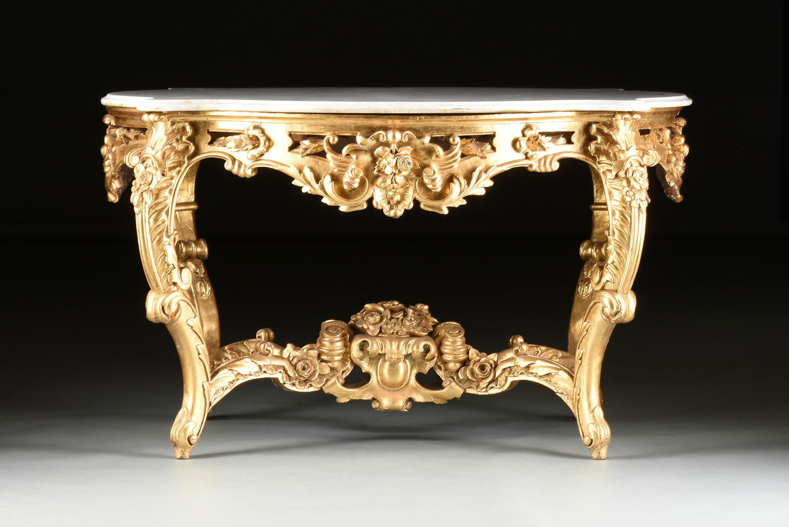 A ROCOCO REVIVAL  MARBLE TOPPED AND CARVED GILTWOOD CENTER TABLE, POSSIBLY ITALIAN, MID 19TH (1 of 9)