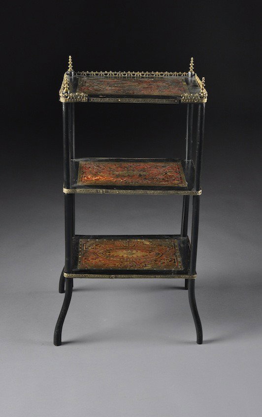 A VICTORIAN BRASS AND TORTOISESHELL INLAID BOULLE ƒ: A VICTORIAN BRASS AND TORTOISESHELL INLAID BOULLE ƒTAGéRE, LATE 19TH CENTURY, the rectangular ebonized wood top shelf centering an inlaid panel with scrolling foliage enclosing an oval medallion of 