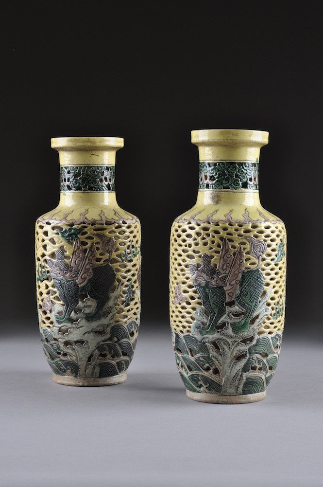 A PAIR OF FAMILLE VERT PORCELAIN VASES, KANG HSI D: A PAIR OF FAMILLE VERT PORCELAIN VASES, KANG HSI DYNASTY 1662-1722, each of tapering ovoid form with reticulated outer wall enameled with beasts and bats. Incised six character mark on underside. Heig