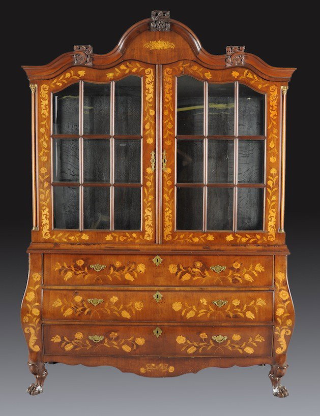 A DUTCH ROCOCO FLORAL MARQUETRY MAHOGANY CABINET, : A DUTCH ROCOCO FLORAL MARQUETRY MAHOGANY CABINET, FIRST HALF 19TH CENTURY, the shaped arched cornice centering florette detailed bracket pedestals above conforming glazed doors with molded mullions op