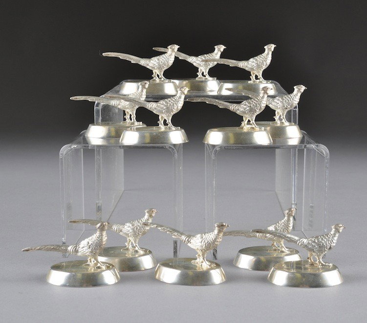 A SET OF TWELVE TIFFANY STERLING SILVER PLACECARD : A SET OF TWELVE TIFFANY STERLING SILVER PLACECARD HOLDERS, ITALIAN, LATE 20TH CENTURY, each modeled as a pheasant on an oval plinth, stamped on underside with a star over a CF enclosed by a shield abo