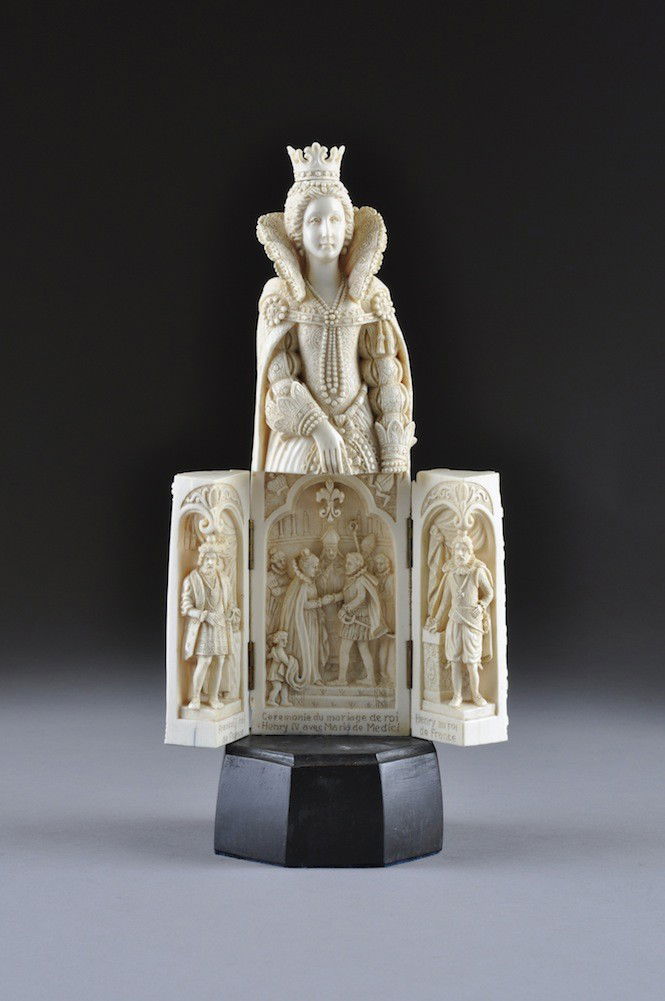 A FRENCH CARVED IVORY FIGURE OF MARIE DE MEDICI, P: A FRENCH CARVED IVORY FIGURE OF MARIE DE MEDICI, POSSIBLY DIEPPE, LATE 19TH CENTURY, the elaborately detailed incised figure of the Queen wearing full court dress and jewelry, with lower section openi