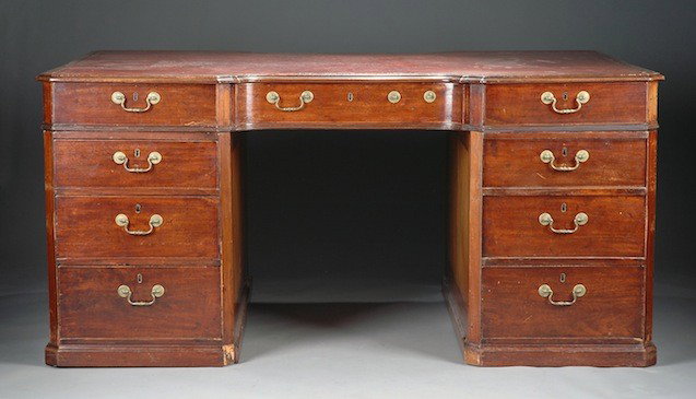 A GEORGE III MAHOGANY PARTNER'S DESK, SECOND HALF : A GEORGE III MAHOGANY PARTNER'S DESK, SECOND HALF 18TH CENTURY, the shaped rectangular top with conforming tooled leather writing surface enclosed by a molded border above an inset long drawer flanked