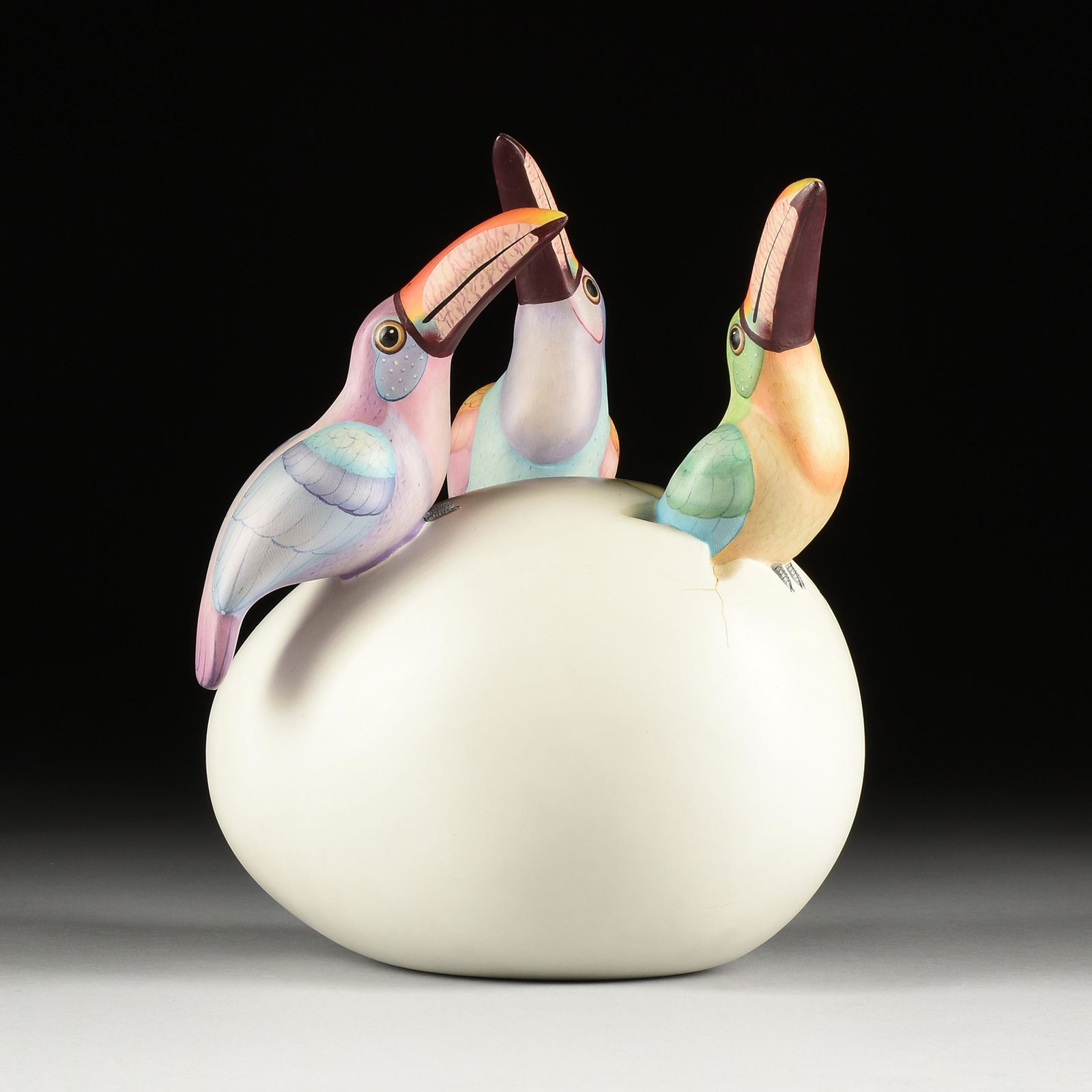 SERGIO BUSTAMANTE (Mexican b. 1949) A SCULPTURE, "Three Toucans on an Egg,": SERGIO BUSTAMANTE (Mexican b. 1949) A SCULPTURE, "Three Toucans on an Egg," hand-painted ceramic, signed, "Sergio Bustamante." Height: 10" Width: 10" Depth: 6" Note: Sergio Bustamante, Mexico's belove