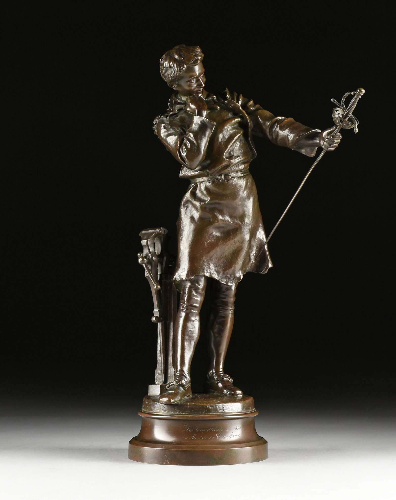 HENRY KOSSOWSKI (Polish/French 1855-1921) A SCULPTURE, "The Armorer," 19TH/20TH CENTURY,: HENRY KOSSOWSKI (Polish/French 1855-1921) A SCULPTURE, "The Armorer," 19TH/20TH CENTURY, bronze with brown patina, inscribed with the artist's name at the base, "H Kossowski," and with the foundry mar